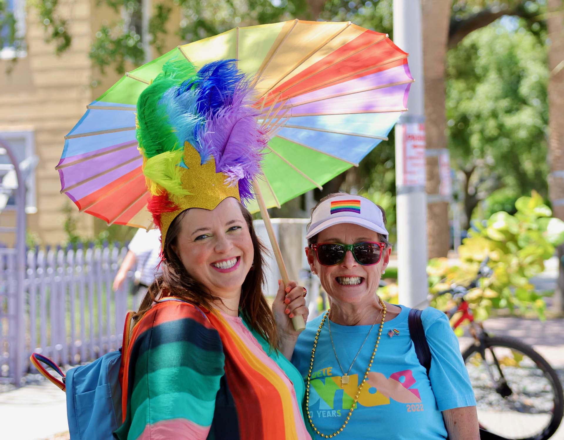 Festivalgoers with rainbow umbrella at Gulfport Pride
